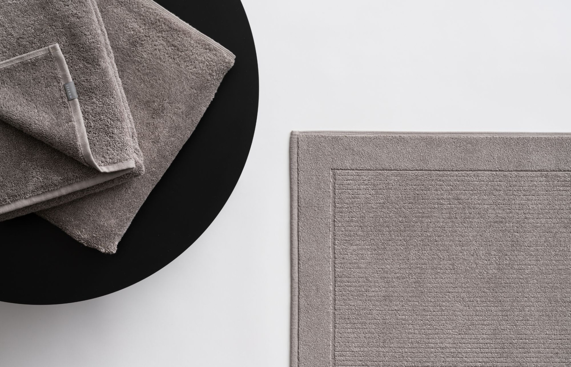 Our Brave Grey 100% cotton bath mat. 